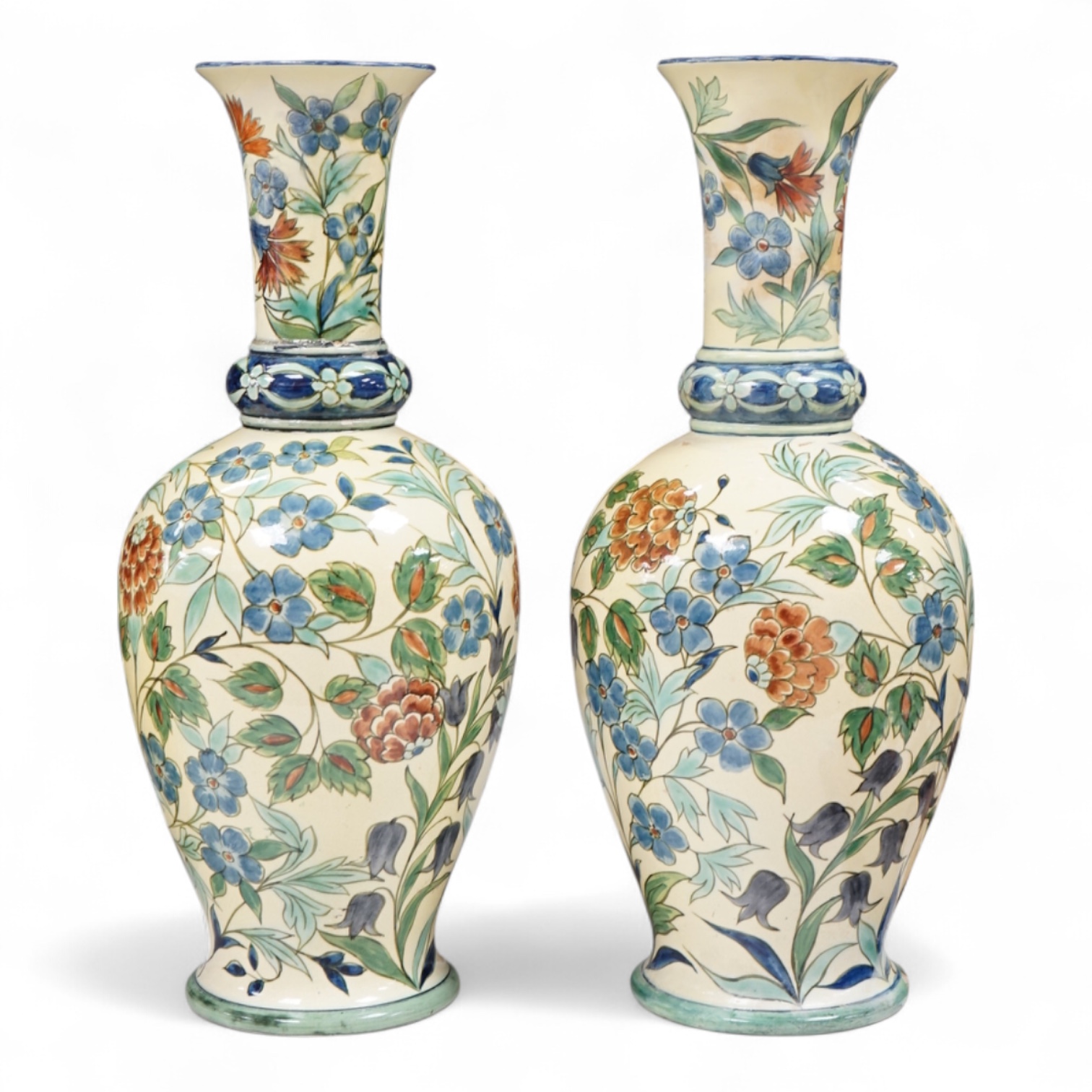 A pair of Doulton Lambeth Persian inspired faience vases, dated 1877, restored, 37cm high